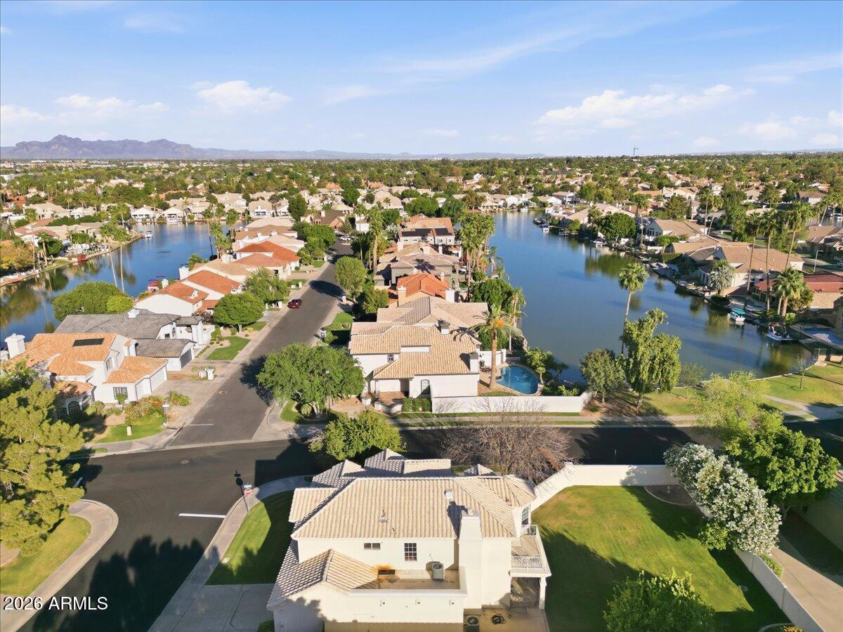 an aerial view of a house with a lake view