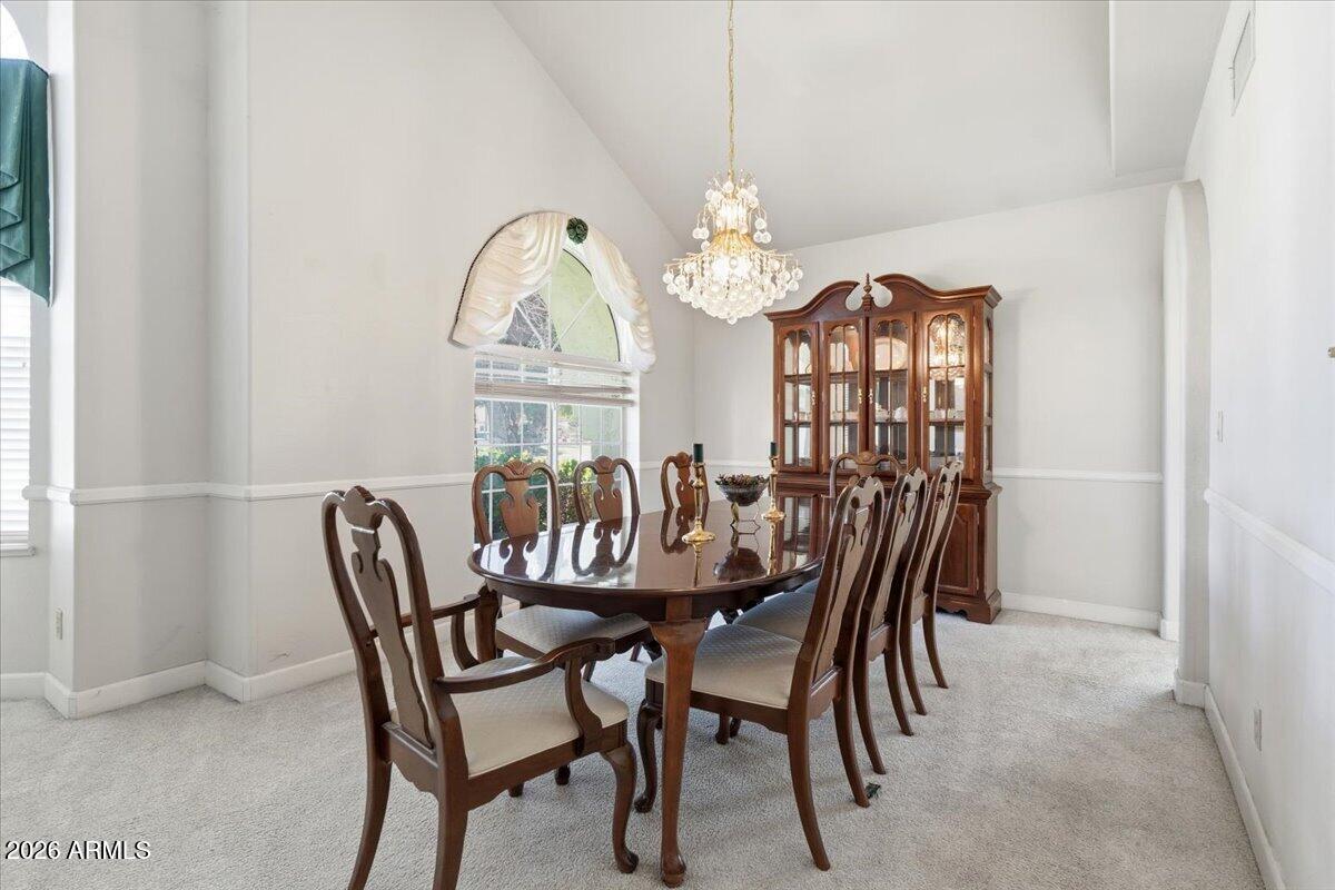 1919 East Clipper Court Gilbert, AZ 85234 - Photo 12 of 62 a view of a dining room with furniture and a chandelier