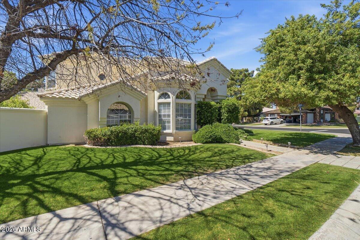 1919 East Clipper Court Gilbert, AZ 85234 - Photo 2 of 62 a front view of a house with a yard