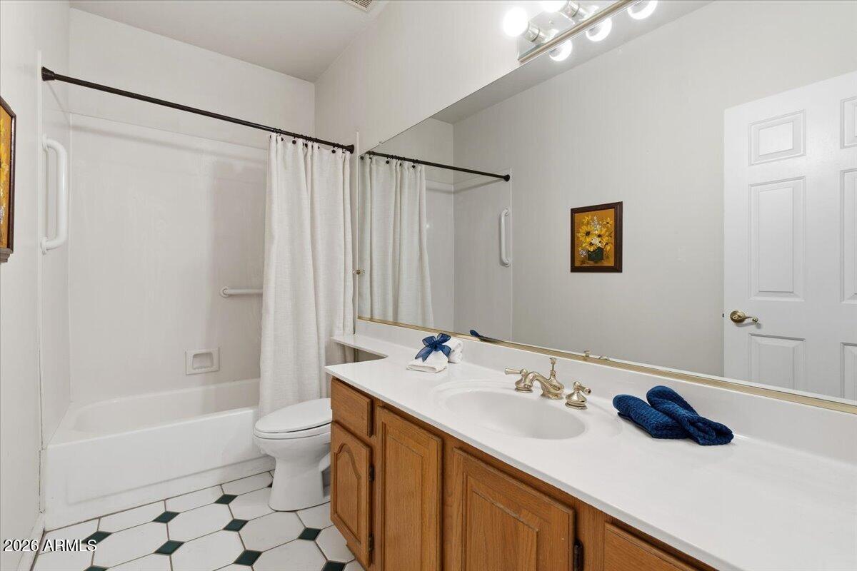 1919 East Clipper Court Gilbert, AZ 85234 - Photo 25 of 62 a bathroom with a sink and a mirror