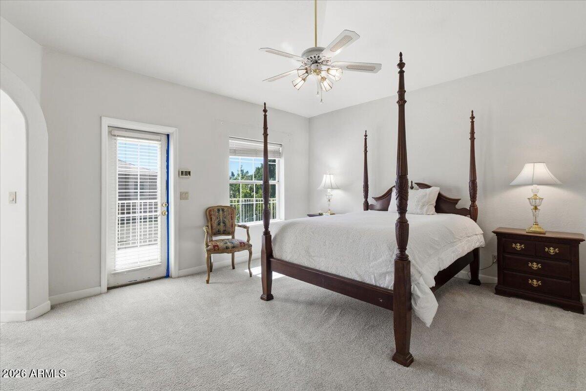 1919 East Clipper Court Gilbert, AZ 85234 - Photo 26 of 62 a bedroom with a bed chandelier and window