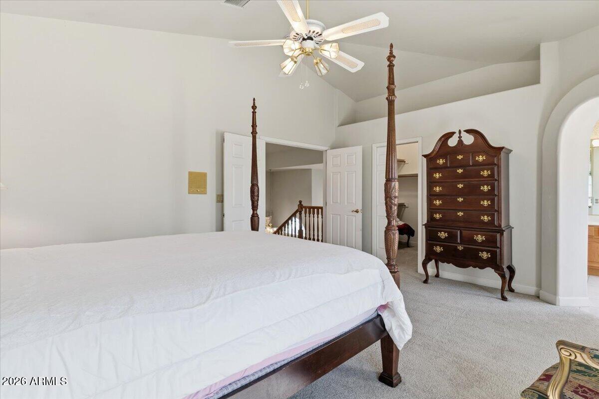 1919 East Clipper Court Gilbert, AZ 85234 - Photo 27 of 62 a bedroom with a bed a dresser and a chandelier