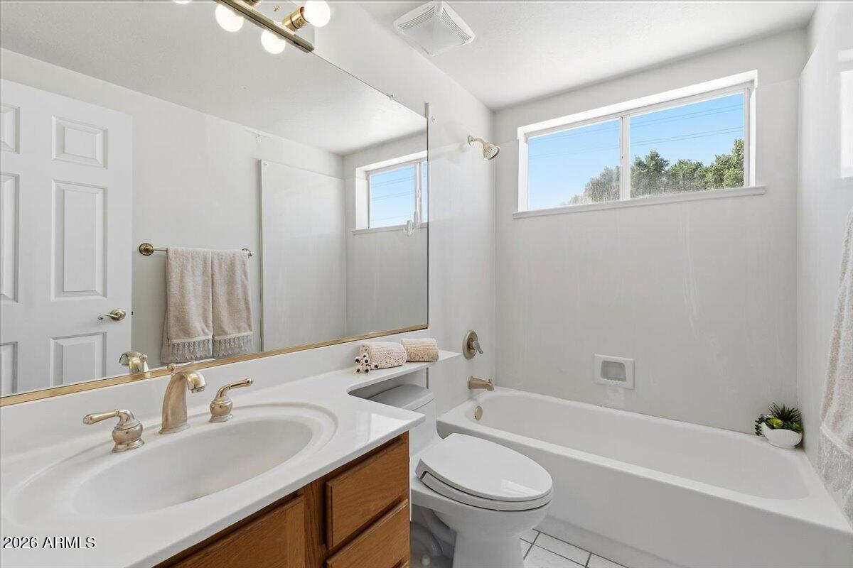1919 East Clipper Court Gilbert, AZ 85234 - Photo 37 of 62 a bathroom with a sink and a mirror
