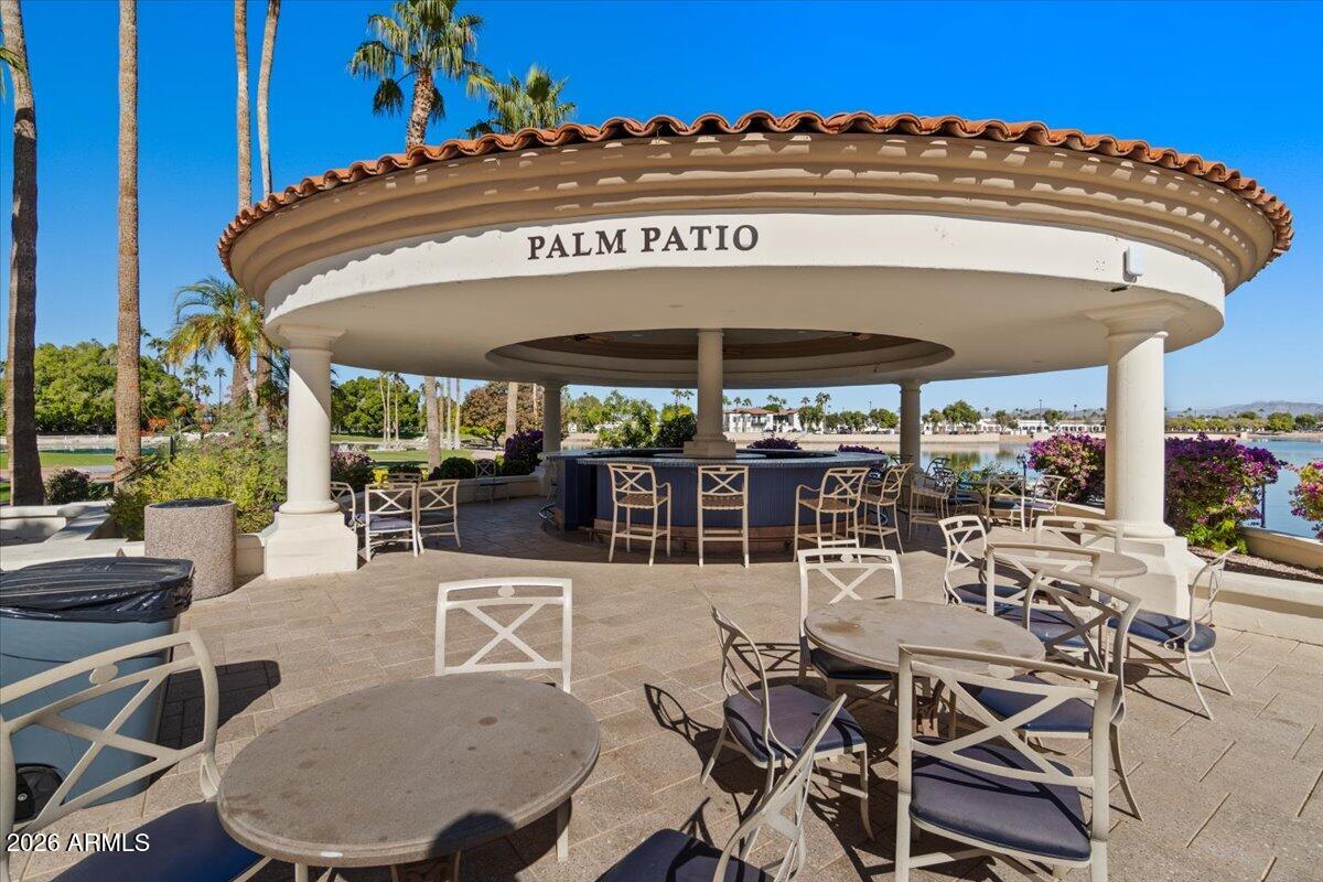 1919 East Clipper Court Gilbert, AZ 85234 - Photo 61 of 62 a view of a patio with table and chairs under an umbrella