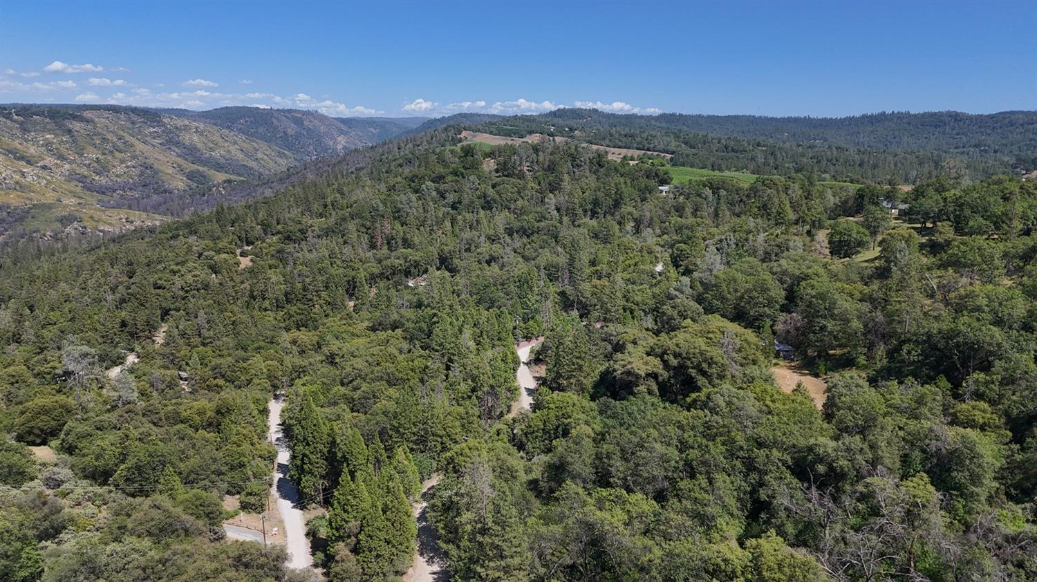6860 Ant Hill Road Somerset, CA 95684 - Photo 35 of 40 a view of a city with mountains in the background