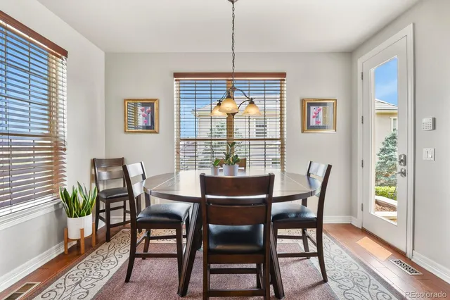 a dining room with furniture and window