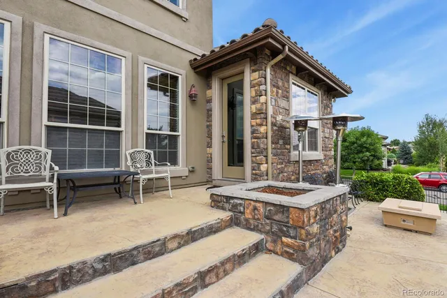 a view of a patio with a table and chairs in patio