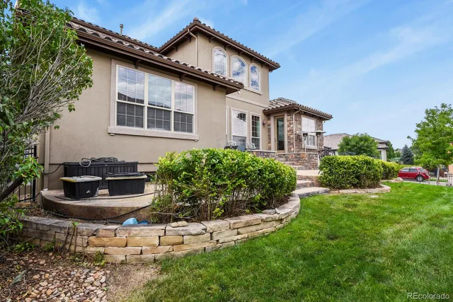 a view of a patio with table and chairs and potted plants