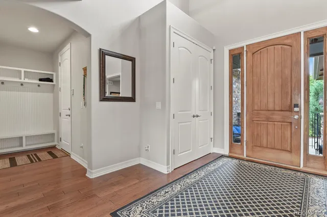 a view of a room with wooden floor and cabinet