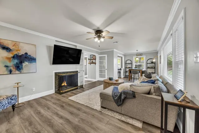 a living room with furniture fireplace and a flat screen tv