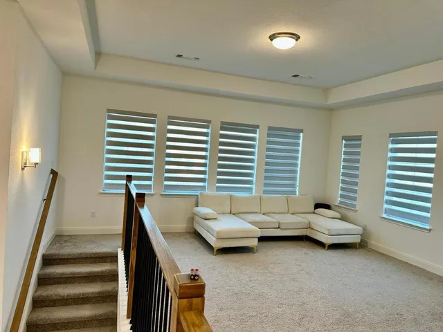 a bedroom with furniture and windows