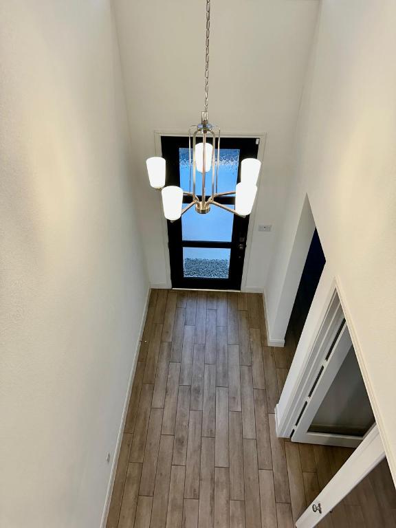 1113 Scenic Grn Loop Georgetown, TX 78628 - Photo 25 of 38 a living room with furniture and a wooden floor