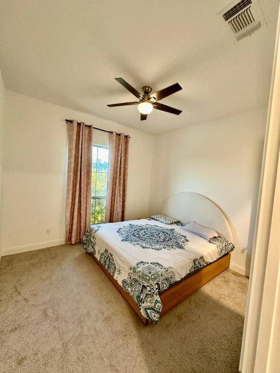 1113 Scenic Grn Loop Georgetown, TX 78628 - Photo 9 of 38 a bedroom with a bed and window