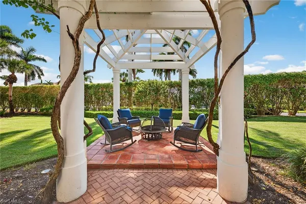 a view of a garden with an outdoor space and seating area