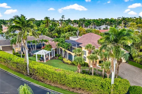 a view of a house with backyard porch and sitting area