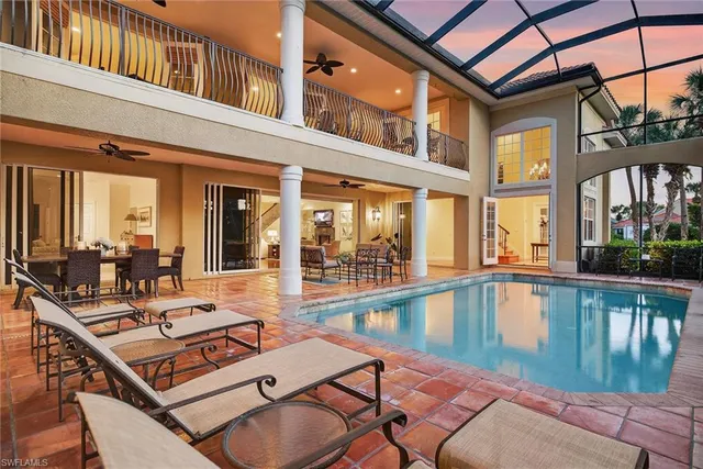 a view of a patio with swimming pool table and chairs