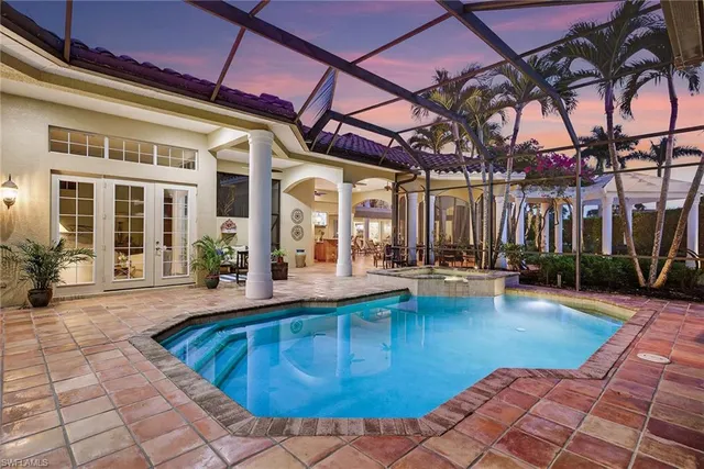 a building outdoor space with patio couch and potted plant