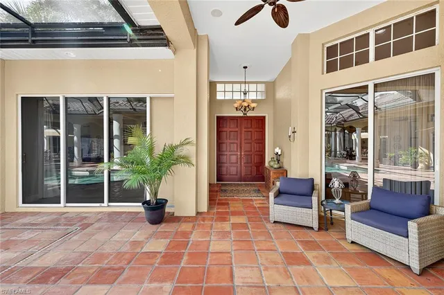 a living room with furniture a dining table and a bookshelf