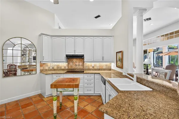 a bedroom with a bed wooden floor and window