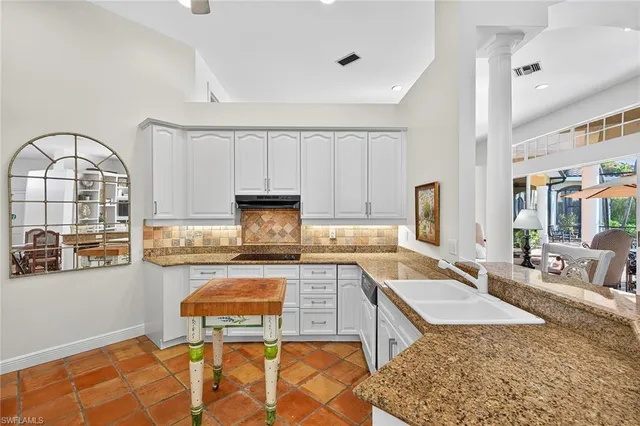 a bedroom with a bed wooden floor and window