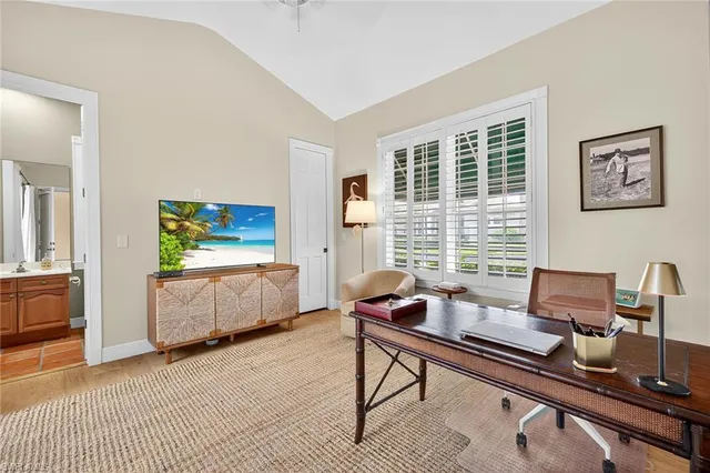 a bathroom with double vanity sinks a large mirror and a shower
