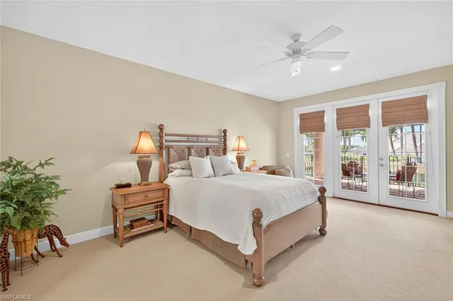 a spacious bathroom with a double vanity sink toilet and a mirror