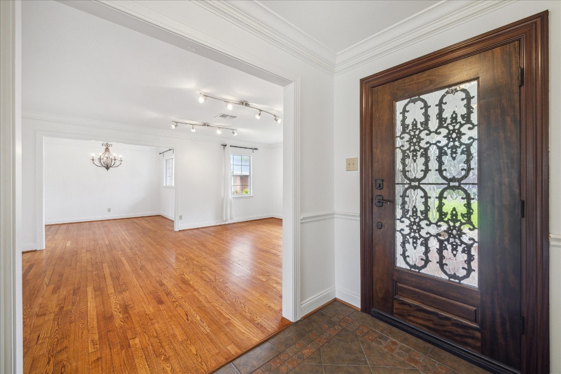 10 Pom Court Spring Valley Village, TX 77055 - Photo 5 of 27 wooden floor in an empty room with a window