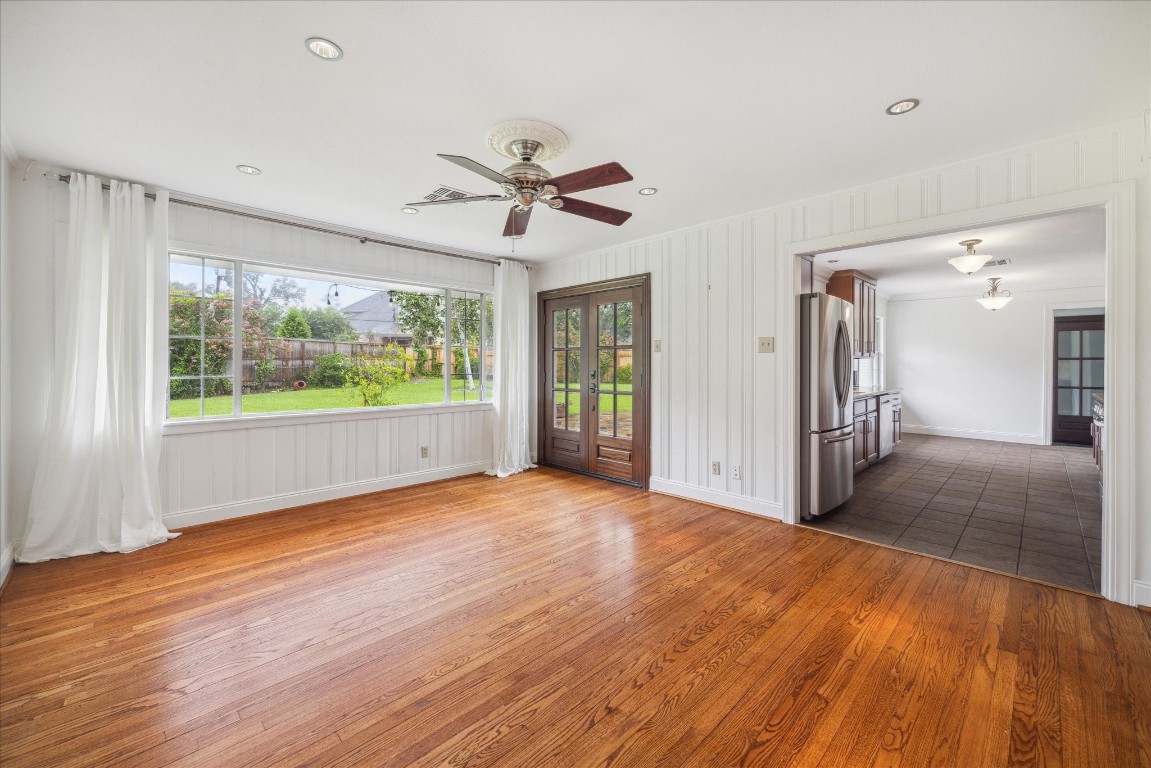 10 Pom Court Spring Valley Village, TX 77055 - Photo 6 of 27 a view of empty room with wooden floor and fan