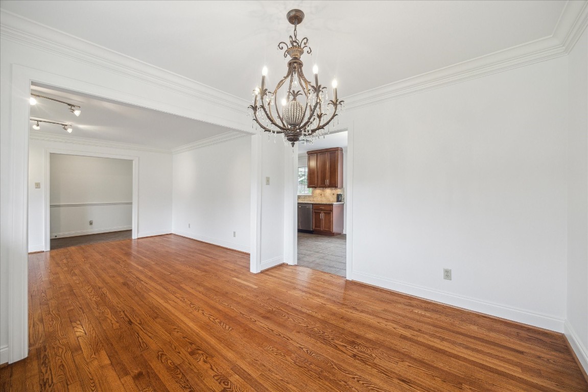 10 Pom Court Spring Valley Village, TX 77055 - Photo 9 of 27 a view of empty room with wooden floor
