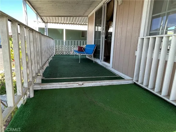 a view of outdoor space with deck and furniture