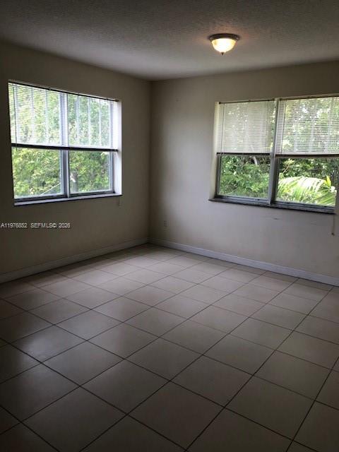 843 Southwest 13th Avenue, Unit 201 Miami, FL 33135 - Photo 6 of 6 an empty room with windows