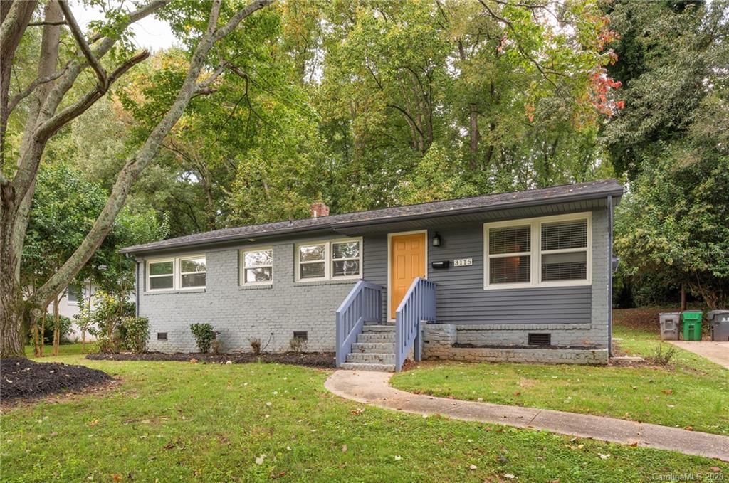 front view of a house with a yard