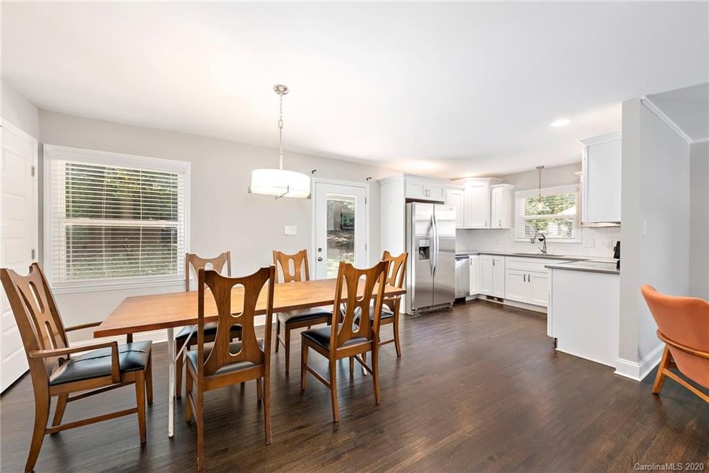 3115 Sudbury Road Charlotte, NC 28205 - Photo 5 of 17 a view of a dining room with furniture and wooden floor