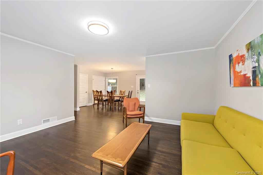 3115 Sudbury Road Charlotte, NC 28205 - Photo 8 of 17 a living room with furniture and a wooden floor