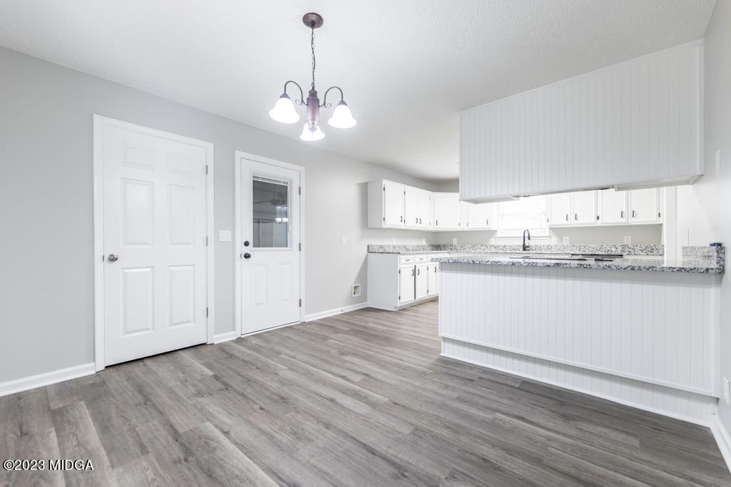 1734 Dixon Road Roberta, GA 31078 - Photo 15 of 40 a view of a kitchen with marble kitchen and kitchen island