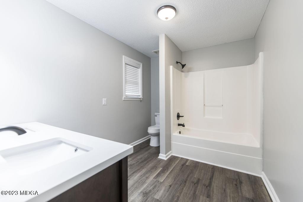 1734 Dixon Road Roberta, GA 31078 - Photo 28 of 40 a bathroom with a sink a toilet and shower
