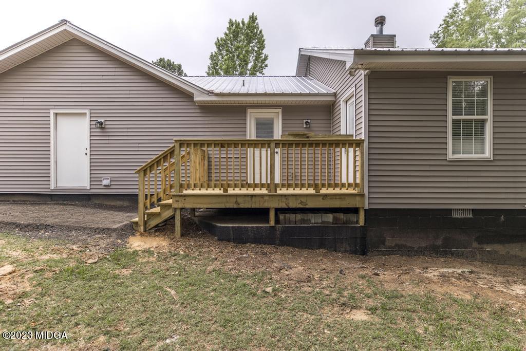 1734 Dixon Road Roberta, GA 31078 - Photo 33 of 40 a view of a house with a wooden deck