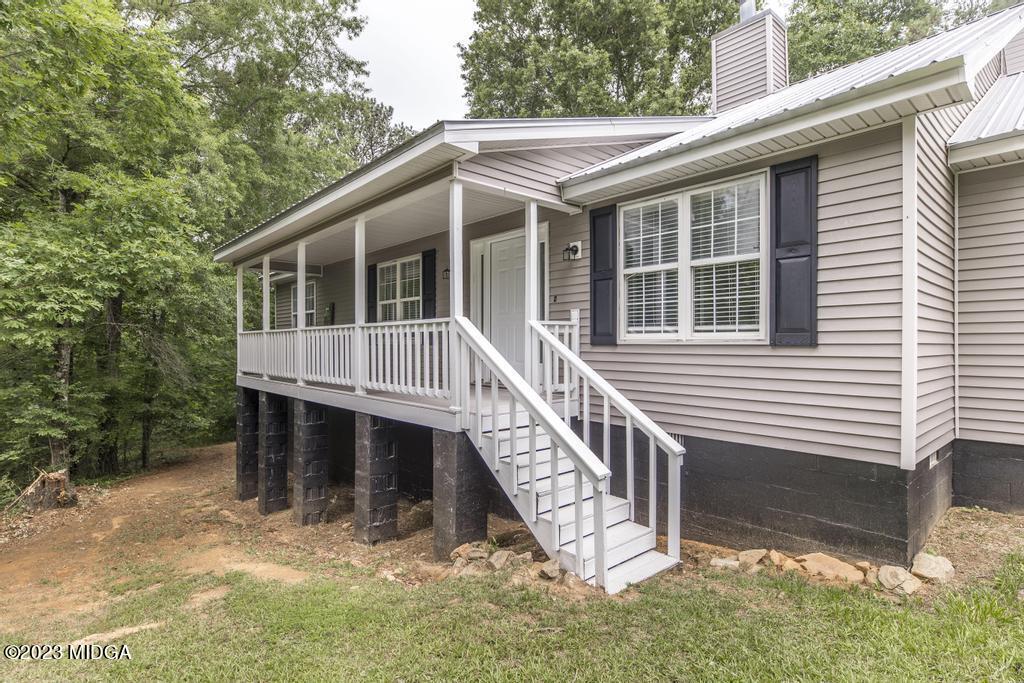 1734 Dixon Road Roberta, GA 31078 - Photo 4 of 40 a house with trees in front of it