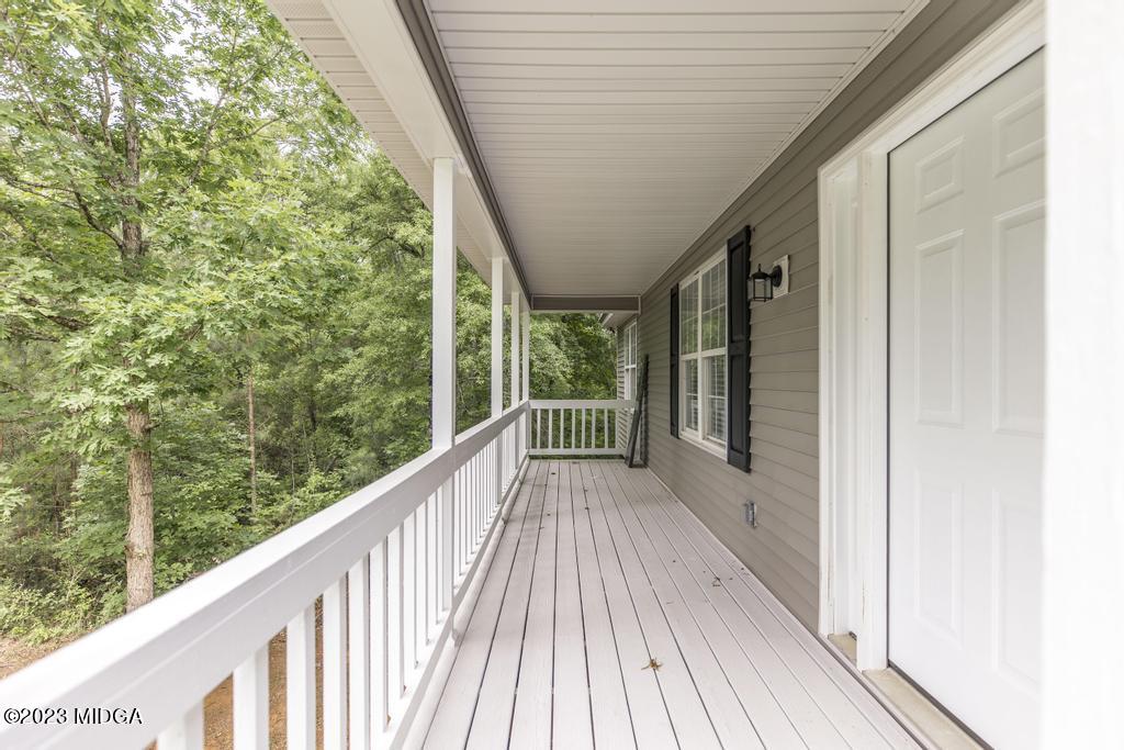 1734 Dixon Road Roberta, GA 31078 - Photo 6 of 40 a view of balcony with wooden floor