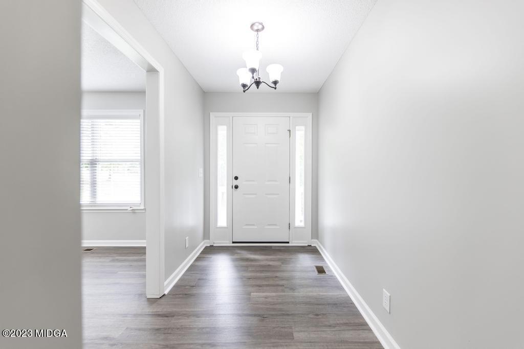 1734 Dixon Road Roberta, GA 31078 - Photo 7 of 40 wooden floor in an empty room with a window