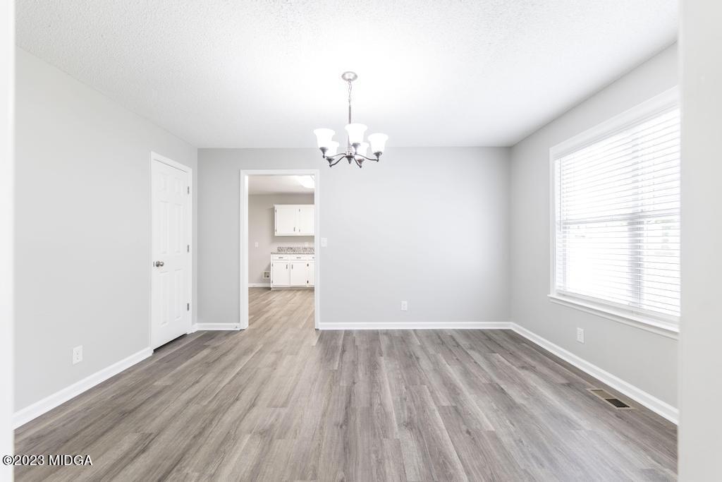 1734 Dixon Road Roberta, GA 31078 - Photo 8 of 40 wooden floor in an empty room with a window
