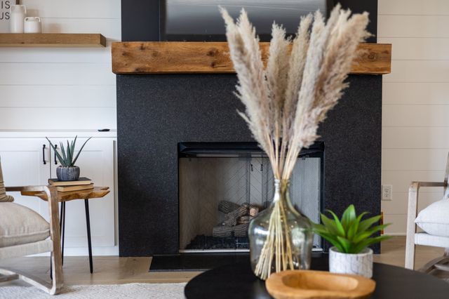 a kitchen with stainless steel appliances granite countertop a stove a sink a oven a dining table and chairs