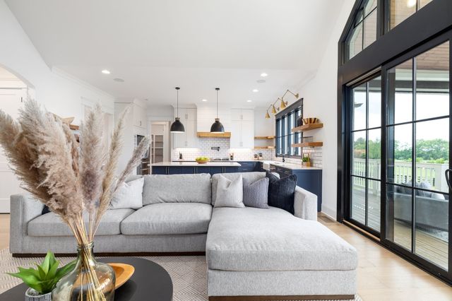 a kitchen with a sink a stove and a refrigerator