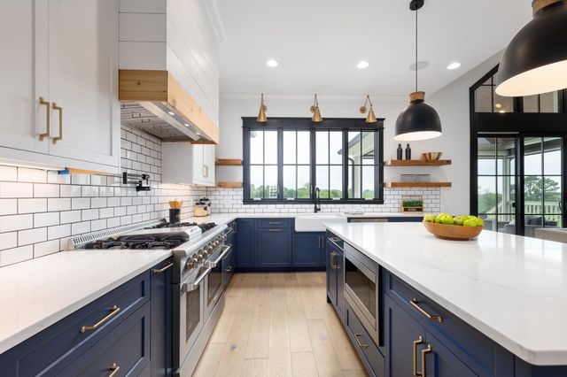a bedroom with a bed dresser and a large window