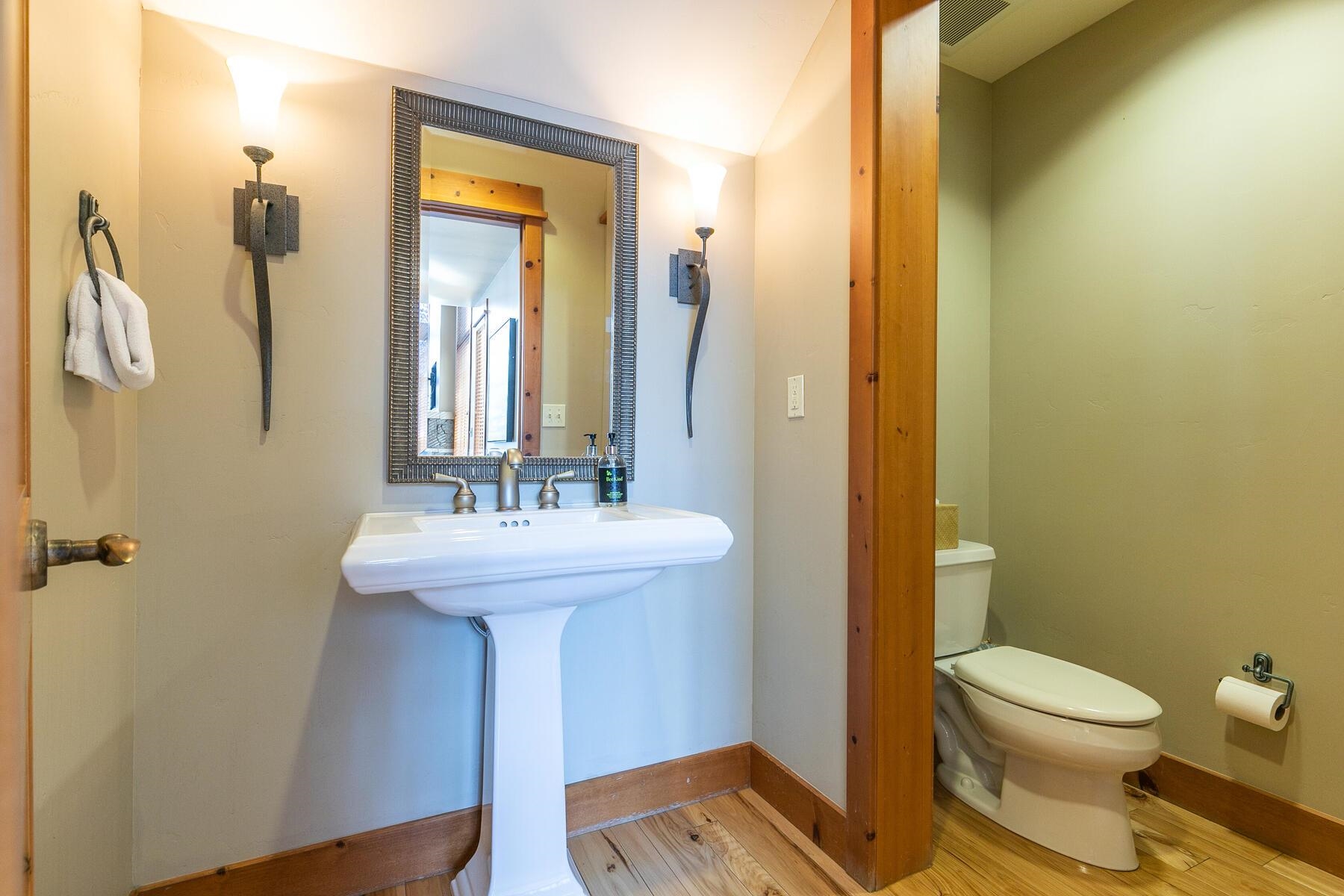 12193 Lookout Loop, Unit F0301 Truckee, CA 96161 - Photo 20 of 26 a bathroom with a sink a toilet and shower