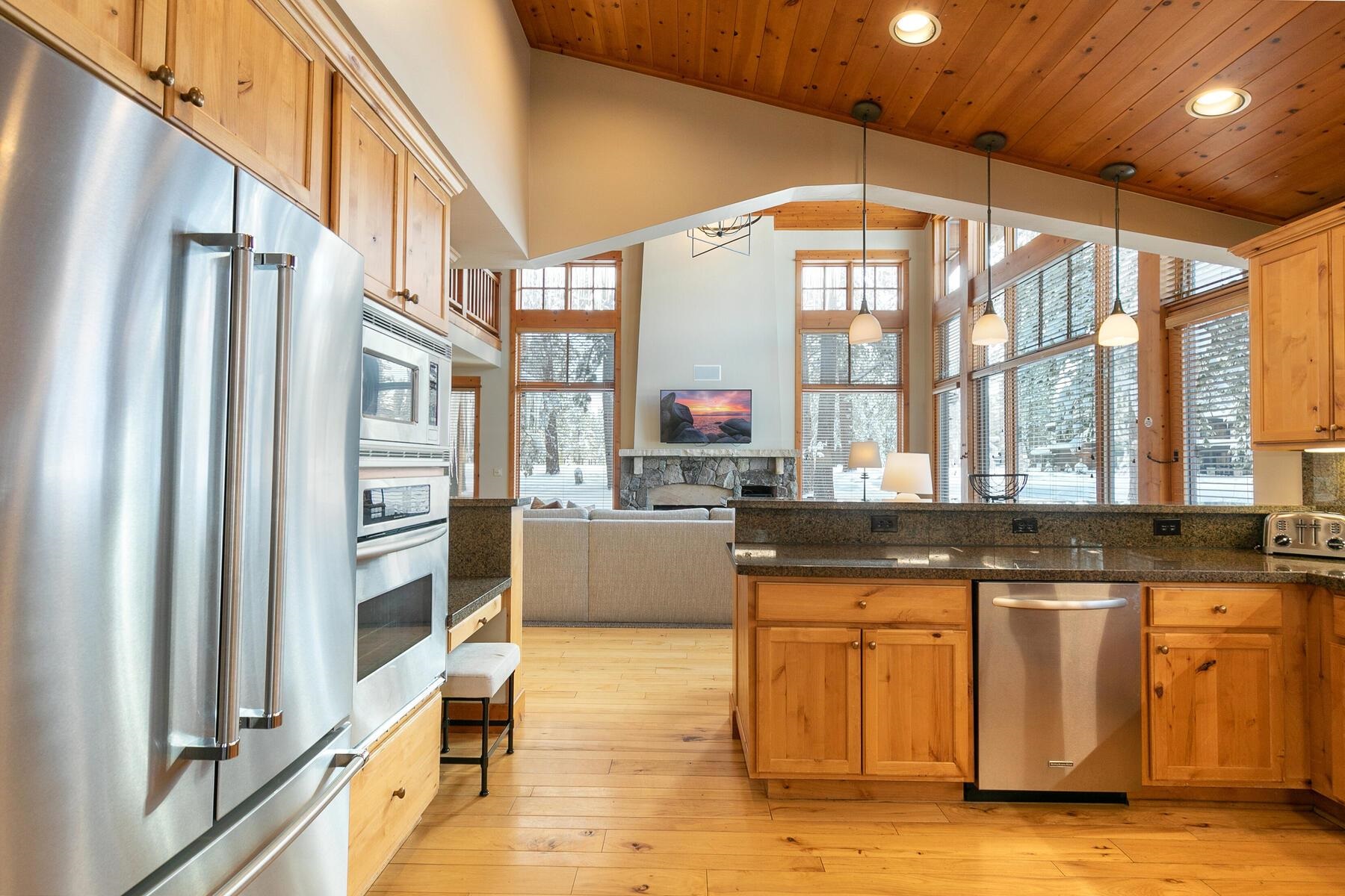 12193 Lookout Loop, Unit F0301 Truckee, CA 96161 - Photo 9 of 26 a kitchen with stainless steel appliances granite countertop a stove and a refrigerator