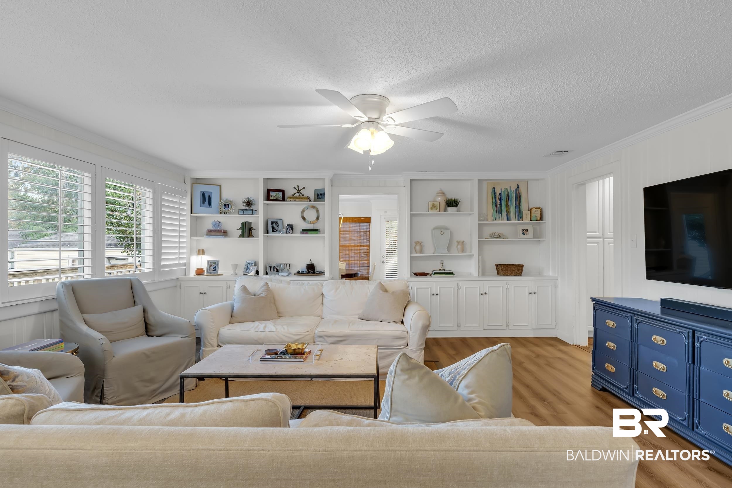18 York Place Mobile, AL 36608 - Photo 4 of 27 Living room featuring wood finished floors, crown molding, a textured ceiling, and ceiling fan