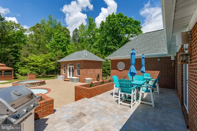a patio with table and chairs