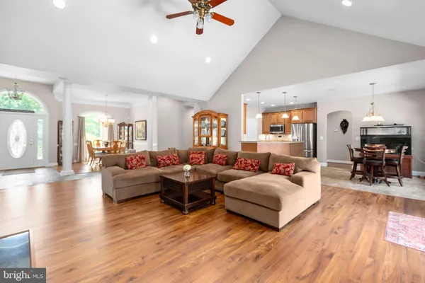 a kitchen with stainless steel appliances granite countertop a sink and a refrigerator