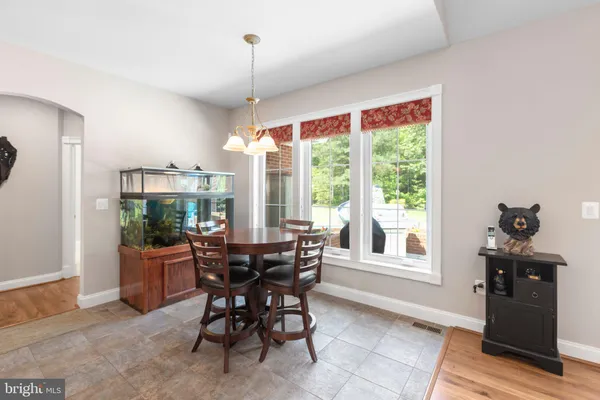 an empty room with closet and a chandelier fan